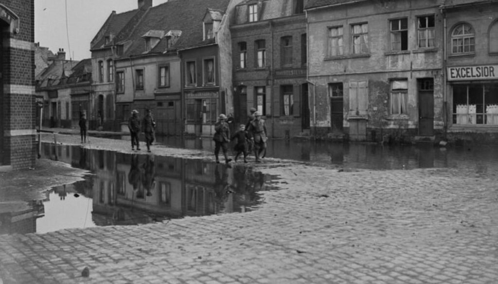 289_A little French girl walking hand in hand with two Canadians through flooded streets of Valenciennes. November, 1918.